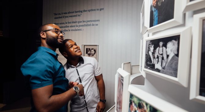 Two people viewing an exhibit at the Canadian Museum for Human Rights.